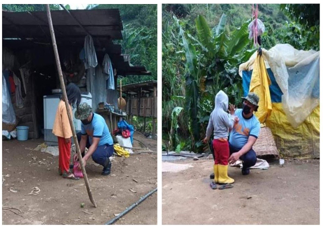 Buguias COPS give rain boots to children