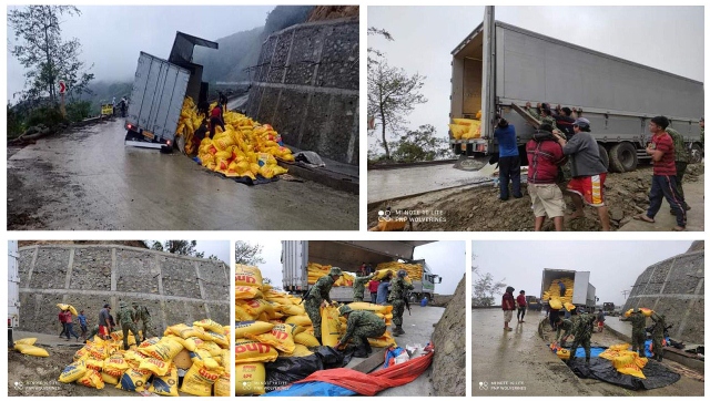 COPS haul scattered sacks of poultry feeds along Bontoc-Banaue Road in Ifugao